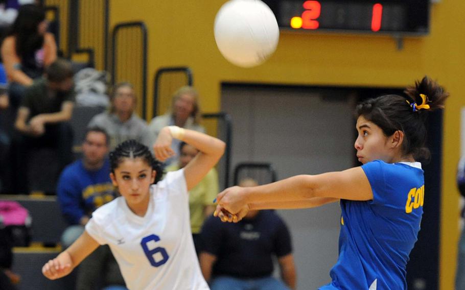 Ansbach's Aurora Alejos takes in a Naples serve as teammate Mikaela Portugal watches. Ansbach fell to the defending Division II champs 23-25, 25-20, 25-17, 25-18 at the DODDS-Europe volleyball championships in Ramstein, Saturday.