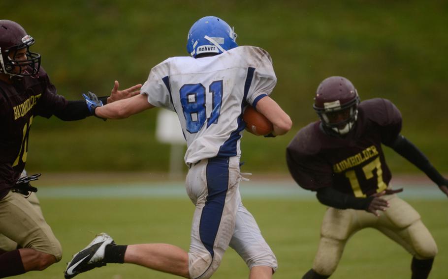 Rota's Brooks Furleigh tries to get past Baumholder's Ben McDaniels after intercepting a pass Saturday afternoon in the 2012 DODDS-Europe Division III football championship in Baumholder, Germany.
