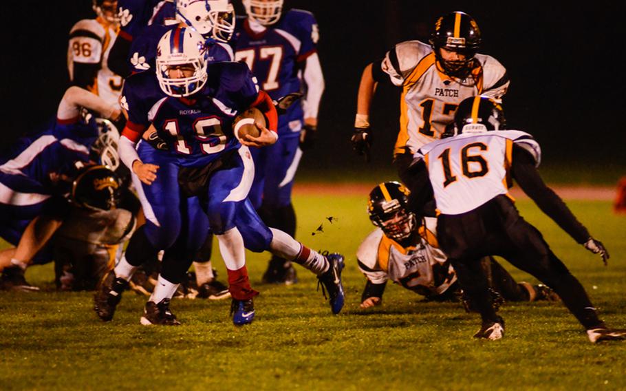Ramstein's Lucas Mireles cuts back to get by Patch's Jake Williams Saturday night in the Division I DODDS-Europe football championship in Baumholder, Germany. Ramstein beat Patch 26-7.
