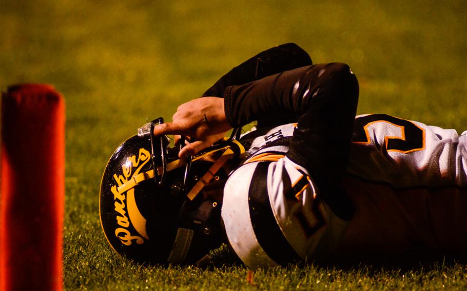 Patch's Jonathan Velasquez lies on the field after narrowly missing a tackle Saturday night in the Division I DODDS-Europe football championship in Baumholder, Germany. Ramstein beat Patch 26-7.