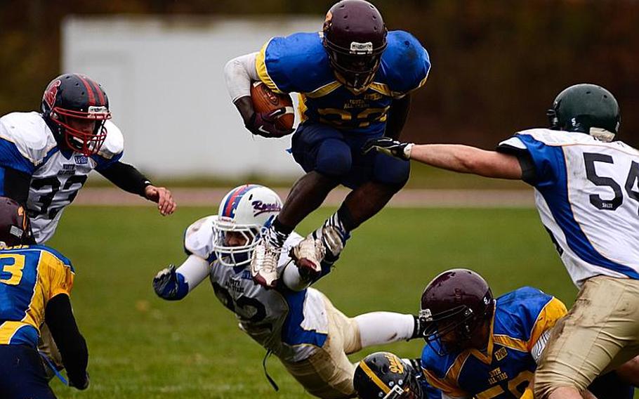 DODDS-Europe South All-Star football team member  Shawn Peebles of Vilseck High School takes to the air in a short gain Saturday afternoon in Vilseck, Germany as the South All-Stars defeated the North 29-10.