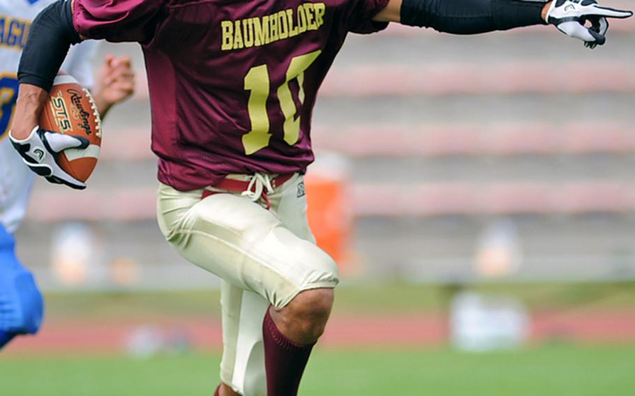 Baumholder's Ben McDaniels directs his blockers as he rushes upfield in a game against Sigonella in September. McDaniels has been selected as Stars and Stripes' football Athlete of the Year.