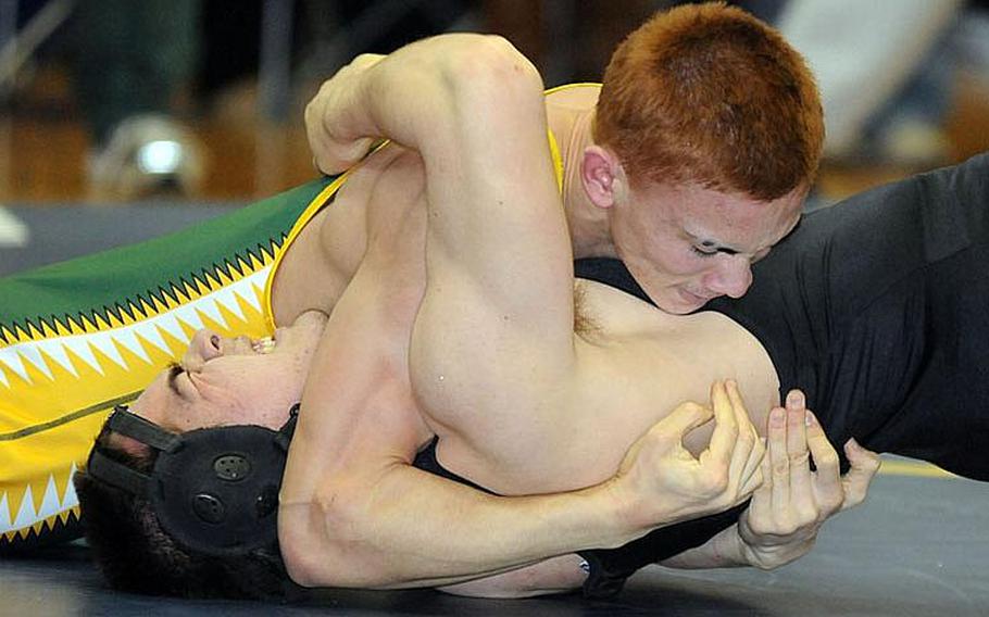 Robert D. Edgren 158-pounder Joel Loy nails the shoulders of Zama American's Josh Mumford to the mat during last year's Division II dual-meet championship bout in the 35th Far East High School Wrestling Tournament. Loy is the Eagles' lone returning wrestler with varsity experience.