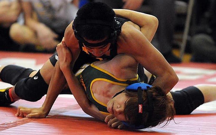 Kadena's Justin Duenas gains the advantage on Robert D. Edgren's Francis Estacion during last year's 101-pound gold-medal bout in the 35th Far East High School Wrestling Tournament. Duenas returns at 108/115 pounds for the Panthers this season.