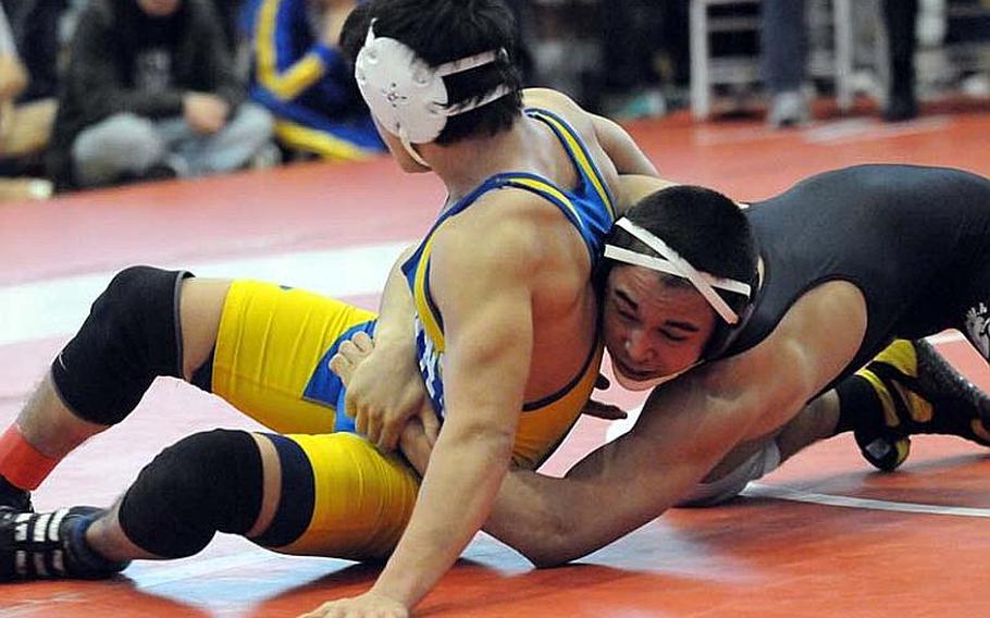 Zama American's Chad Wilder, right, gets the advantage on St. Mary's International's JP Kwak during last year's 141-pound gold-medal bout in the 35th Far East High School Wrestling Tournament. 
Wilder, a senior, returns at 158 pounds for the Trojans, favored to win the D-II titles.