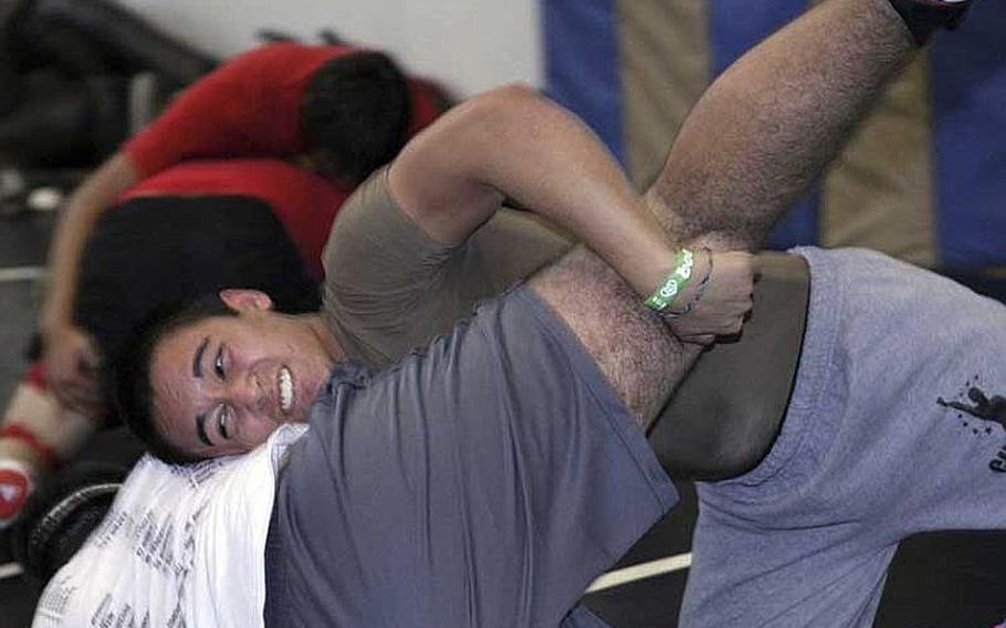 Zama American senior 158-pounder Chad Wilder goes through his paces during Wednesday's high school wrestling practice at Camp Zama, Japan. Wilder won the 141-pound Far East tournament championship last year and is the tournamen's reigning Outstanding Wrestler.