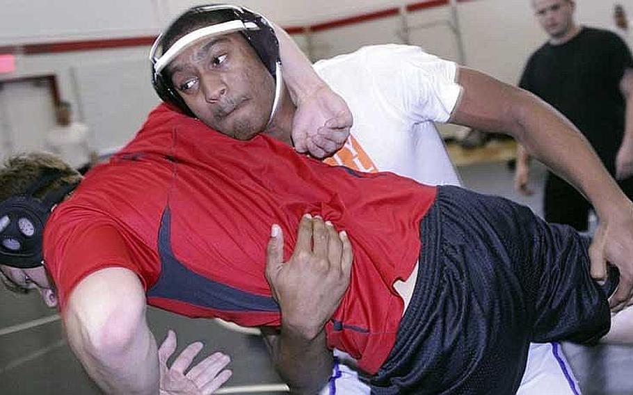 Zama American senior 180-pounder Mitchell Harrison goes through his paces during Wednesday's high school wrestling practice at Camp Zama, Japan.