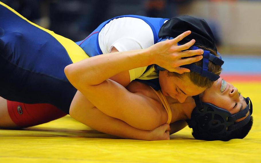 Ramstein's Belen Simpson puts the pressure on Heidelberg's Mathew Hall to take third in the 132-pound weight class at a meet in Wiesbaden on opening day of the 2012-13 DODDS-Europe wrestling season.
