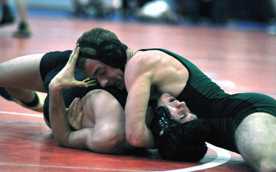Naples' Bryan Pfirrmann gets close to a pin of Vicenza's Marshall Perfetti Saturday in a 160-pound match at a five-team tournament at Aviano Air Base, Italy. Pfirrmann, a senior, won the match and his weight class.