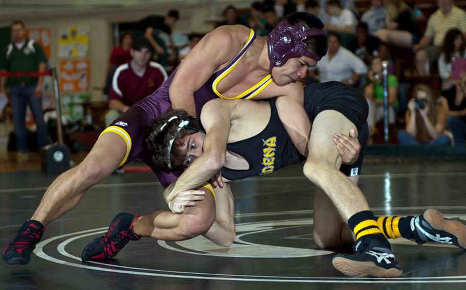 Father Duenas Memorial's Pavin Blas gets the upper hand on Kadena's Zach Fanton in the 122-pound gold-medal final during Saturday's individual freestyle phase of the 6th Rumble on the Rock Wrestling Tournament at Camp Foster, Okinawa. Fanton won a two-period decision.