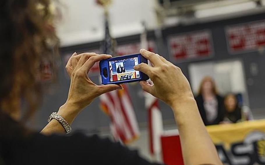 Kaiserslautern senior Ally Murphy and her mom pose for photographs after she signed a national letter of intent to play for Alabama State University, an NCAA Division I program in Montgomery, Ala., in the Kaiserslautern High School gym Tuesday morning.