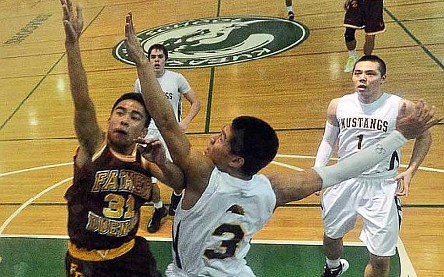 John Baza of Father Duenas Memorial goes up for a shot as American School In Japan contests during Thursday's championship game in the Far East High School Boys Division I Basketball Tournament at Camp Foster, Okinawa. The Mustangs won their first D-I title since 1983, beating the Friars 61-49.