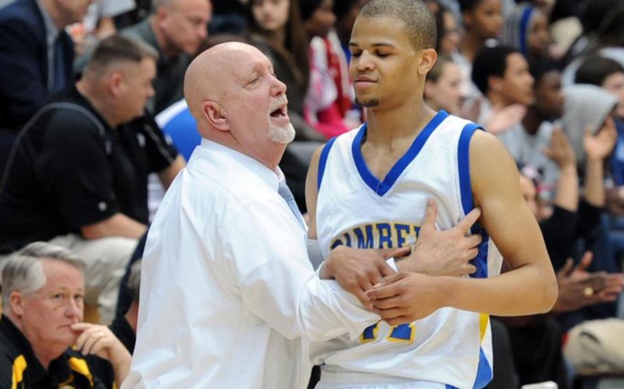 Bamberg coach Tim Smith congratulates Terry Williams when he came out of the game in the final minute in the Division III title game at the DODDS-Europe Basketball Championships in Wiesbaden, Germany, Saturday. Bamberg took the title with a 59-43 win.