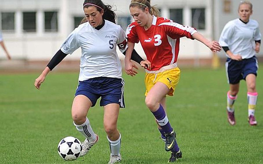 Heidelberg's Layna Lowe, left, and Meredith Stuber fight for a ball in Patch's 1-0 win May 4, 2013. The game, a friendly set up when both teams had a bye week, was the last home soccer game for Heidelberg.