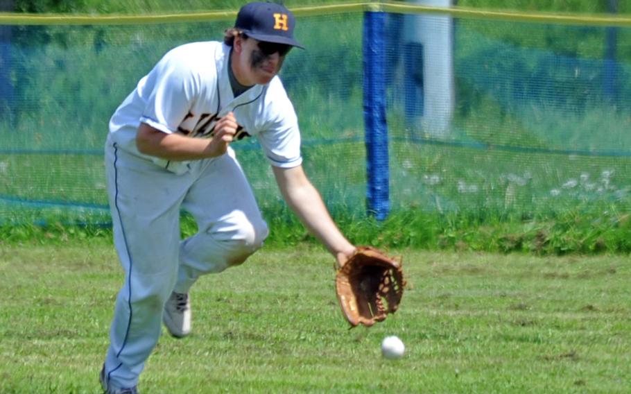 Heidelberg's Grady Mayfield races to a Hohenfels hit, saving extra bases in Heidelberg's last home stand Saturday. The Lions swept a doubleheader from the visiting Tigers.