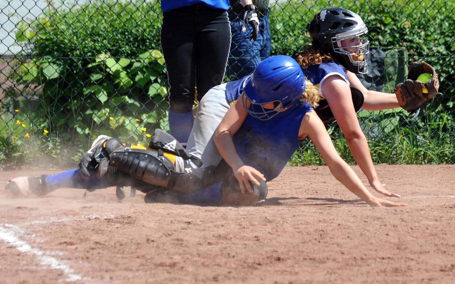 Caroline Bourgeois of Hohenfels slides into home under Heidelberg catcher Brianna Bronell in the the Lions' final home game Saturday. The Tigers beat Heidelberg 24-3, 19-2.