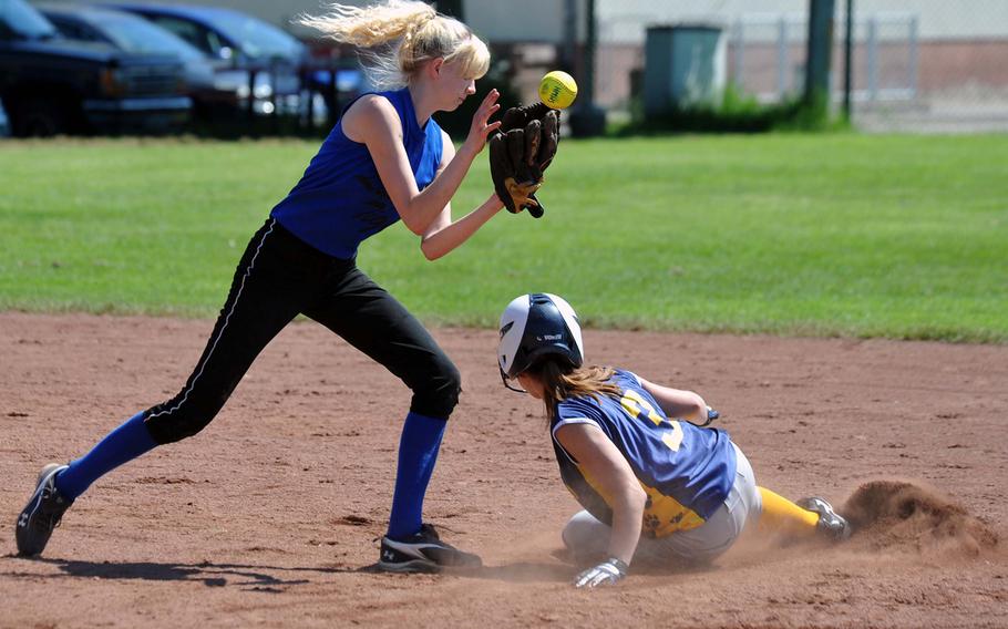 Heidelberg's Katie Hansen slides into second base before Kirsten Atkinson of Hohenfels can pull in the throw. The Lions played their final home games Saturday losing to the visiting Tigers 24-3, 19-2.