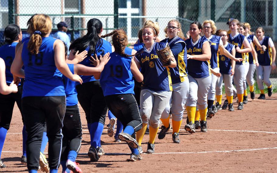 The Heidelberg Lions congratulate the Hohenfels Tigers following the final home softball game for the Lions. Heidelberg dropped the doubleheader Saturday 24-3, 19-2.