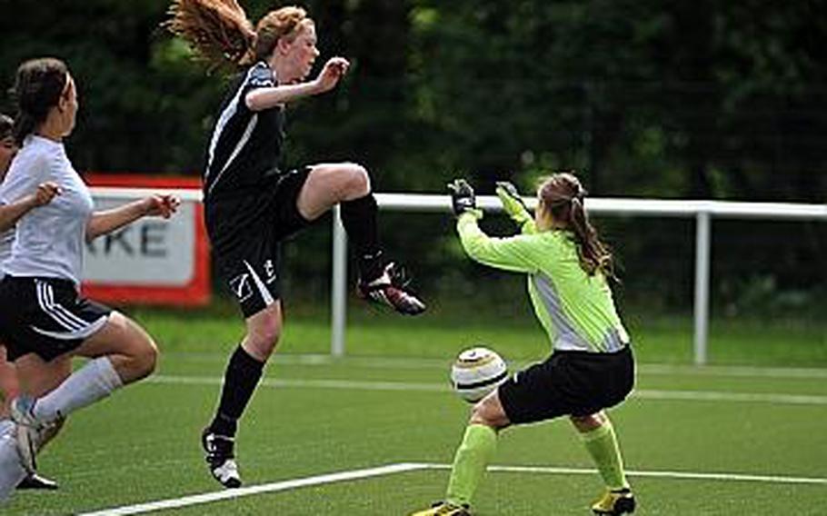 SHAPE's Keneally Phelan tries to get the ball past Vicenza goalie Rima Gasparini  in a Division II semifinal at the DODDS-Europe soccer championships Wednesday. Vicenza beat SHAPE 1-0 to advance to Thursday's final against Naples.