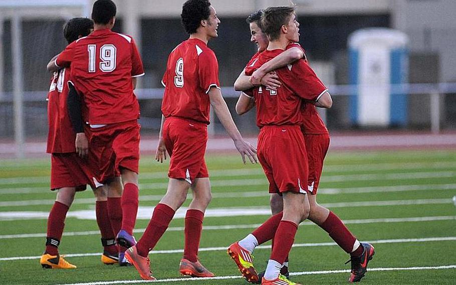 International School of Brussels players celebrate their 3-1 victory over Heidelberg in the Division I final at the DODDS-Europe soccer championships in Kaiserslautern, Germany, Thursday.