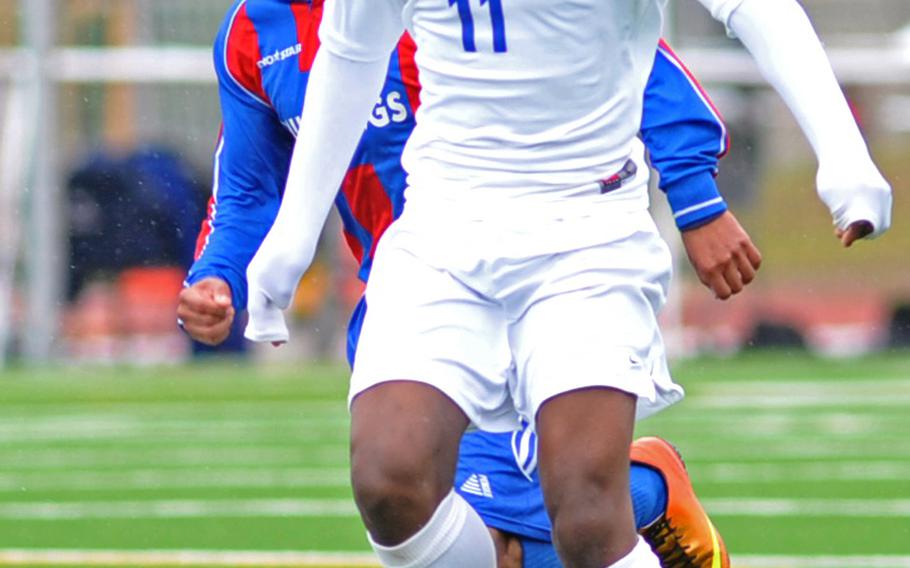 Kristian Javier of Brussels drives the ball upfield against Menwith Hill in the Division III final at the DODDS-Europe soccer championships in Kaiserslautern, Germany, May 25, 2013. Javier scored three goals in the Brigands' 4-2 win, and has been named the Stars and Stripes boys soccer athlete of the year.