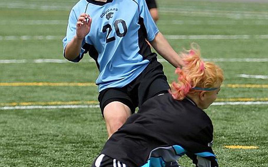 Osan American freshman Ebony Madrid gets stopped at the doorstep by Robert D. Edgren goalkeeper Kayla Eversole during Tuesday's pool-play match in the Far East High School Girls Division II Soccer Tournament at Misawa Air Base, Japan. The Cougars won 1-0. Madrid paced Pacific high school girls scorers with 40 goals and has been named Stars and Stripes' Pacific girls Player of the Year.