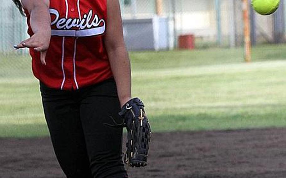 Nile C. Kinnick junior right-hander Kelly Osterbrink, shown pitching in Kinnick's 2-1 Far East Division I Tournament title-clinching win over Kadena, went 13-0 to help the Red Devils post their first unbeaten softball season at 27-0. She has been named Stars and Stripes' Pacific high school girls softball Player of the Year.