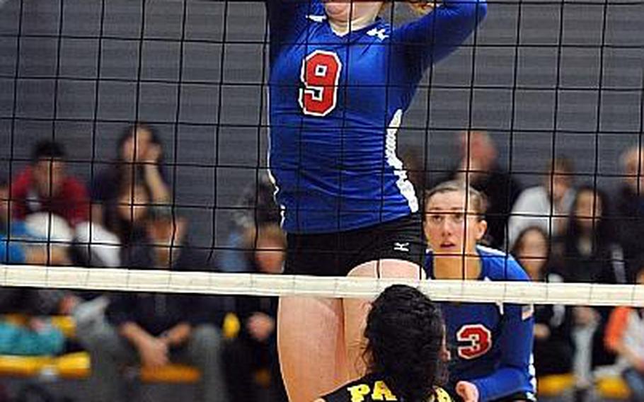 Ramstein's Sarah Schiller knocks the ball over the net against Patch's Stephanie Trujillo in the the Division I final at the DODDS-Europe volleyball championships in Ramstein last year. Schiller will be returning for the Royals when the 2013 season gets under way this weekend.