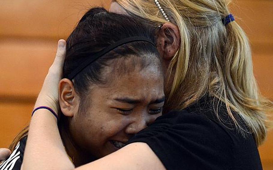 Former Kadena senior middle blocker Nia Rodriguez shares an emotional moment with her coach Kelli Wilson prior to Rodriguez's last match in Kadena uniform on Thursday. The Panthers lost to Kubasaki in straight sets. Rodriguez transferred two days later to Cannon Air Force Base, N.M., and will now play for Clovis High School's Wildcats.