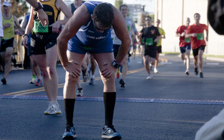 Runners cross the finish line of the 29th annual Army 10-Miler race outside the Pentagon on Oct. 20, 2013.