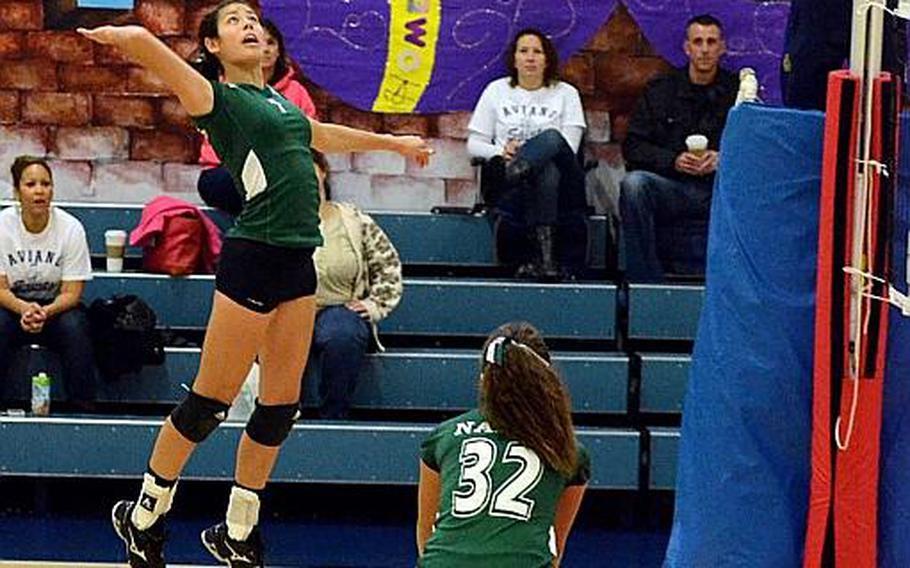 Naples volleyball player Victoria Krause spikes the ball against Aviano Saturday, Oct. 12, 2013, while teammate Skylar Evans watches during a match at Aviano Air Base, Italy. Naples won 25-21, 25-22 and 25-17.  The DODDS-Europe volleyball championships get under way at Ramstein and Kaiserslautern on Thursday, Oct. 31.