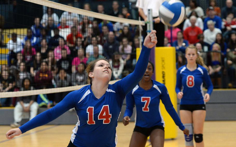 Ramstein's Jenna Kirchhoefer keeps the ball inbounds as teammates Denee Lawrence, center, and Karlijn Van Gaalen watch. Ramstein defeated Lakenheath 25-18, 25-20, 25-19 in the Division I final at the DODDS-Europe volleyball Championships in Ramstein, Germany, Nov. 2, 2013.
