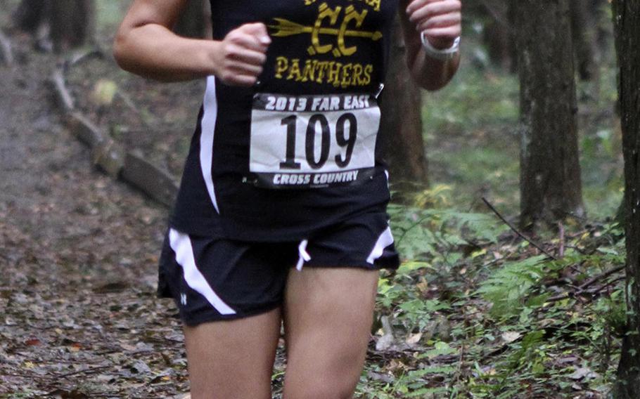 Kadena's Ana Hernandez navigates the wooded part of the course during Monday's 3.1-mile individual girls race in the Far East High School Cross-Country Meet at Camp Fuji, Japan. Hernandez repeated her girls championship, running 21 minutes, 9.4 seconds.