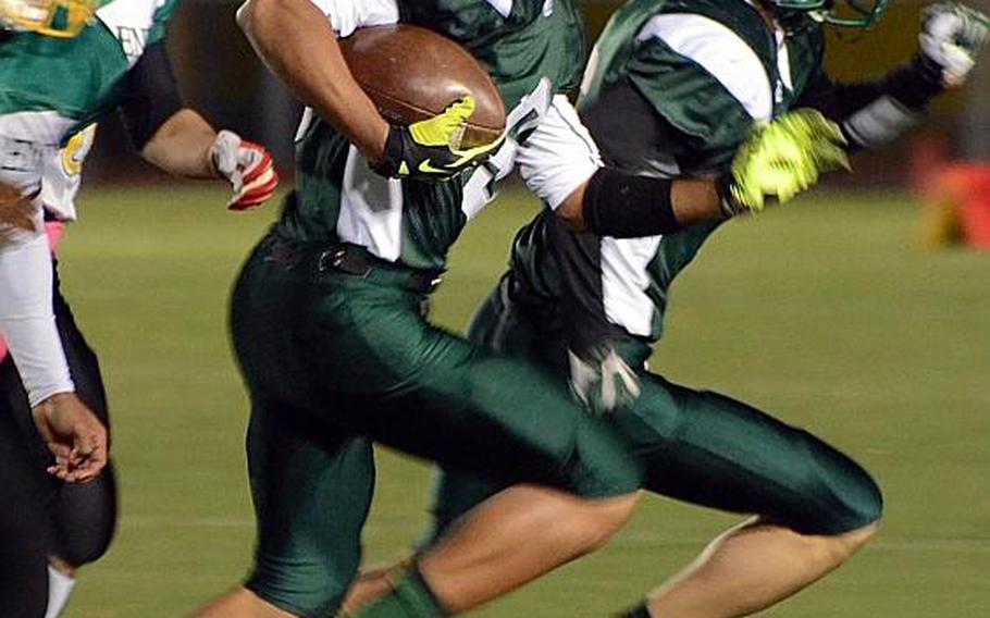 DeAndre Rosalie of Daegu runs into open field against  Robert D. Edgren defenders during Friday's Far East High School Division II football championship game at Camp Walker, South Korea. The Warriors won 33-12.