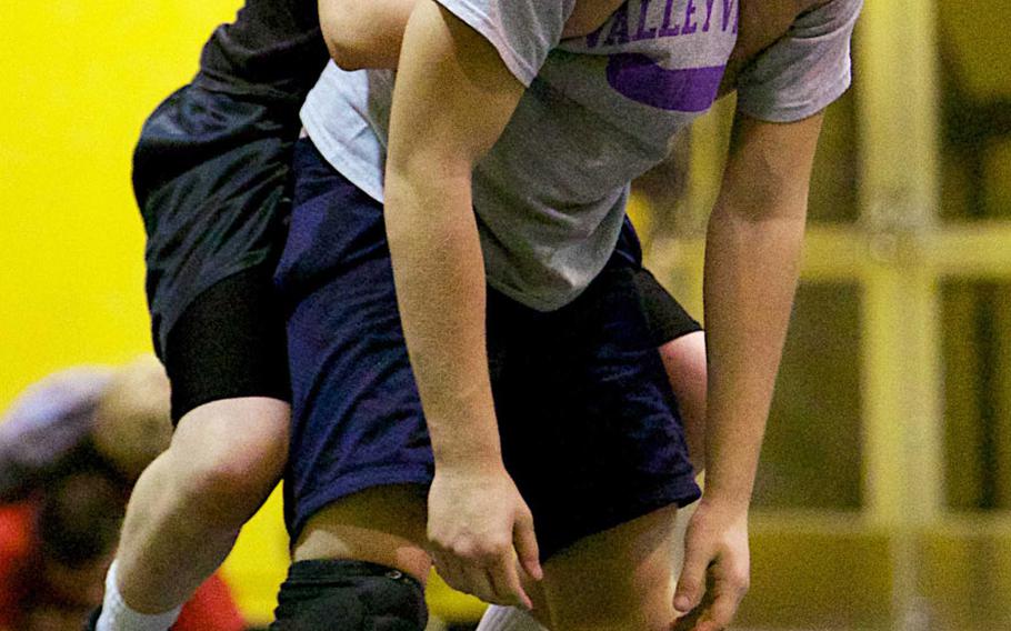 Robert D. Edgren freshman J.P. Krussick and junior Brandon Gleason work out during practice on Wednesday.