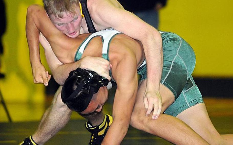 Kadena senior 158-pounder James Alexander, shown wrestling against Kubasaki's Sho Green last season, faces more than opponents this season: He and the entire Pacific high school wrestling field have to get used to new rules implemented for this season by international freestyle wrestling's governing body, FILA.