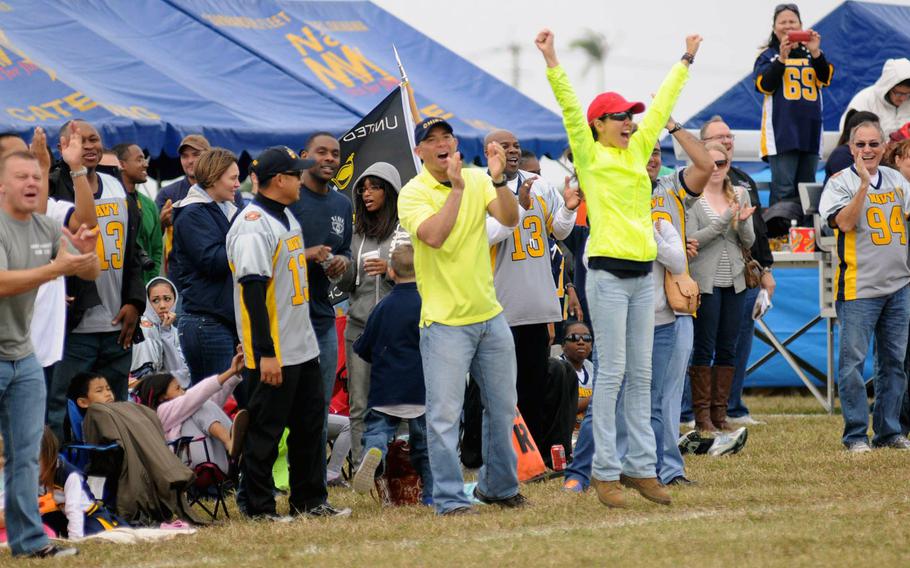 Navy fans cheer a touchdown during Saturday's 24th Army-Navy flag-football rivalry game at Torii Station, Okinawa. Army rallied to win 27-15.