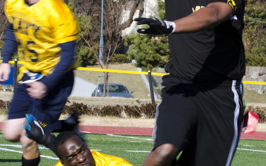 Army quarterback Antuoine Garrett gets sacked during Saturday's Army-Navy flag-football rivalry game at Naval Air Facility Atsugi, Japan. Navy held on to win 13-12.