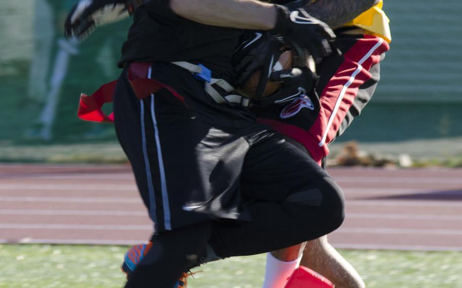 Army receiver Alan Secor gets one foot down in the corner of the end zone to cut Navy's lead to 13-6 in the third quarter of Saturday's Army-Navy flag-football rivalry game at Naval Air Facility Atsugi, Japan. Navy held on to win 13-12.