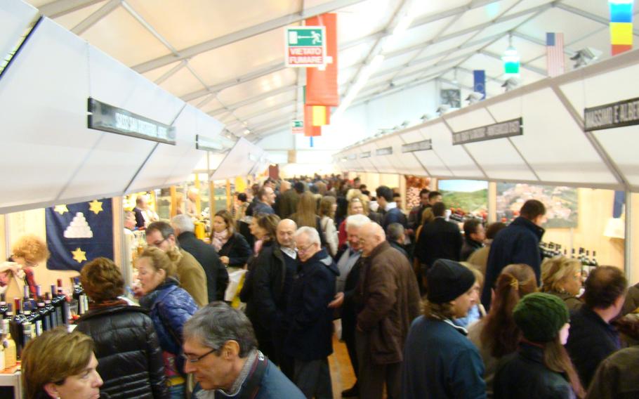 Truffles fans crowd a hall at the largest and most important of Europe's truffle festivals in Alba, Italy, in November 2013. Visitors from all over the world come to sample the exotic delicacy.