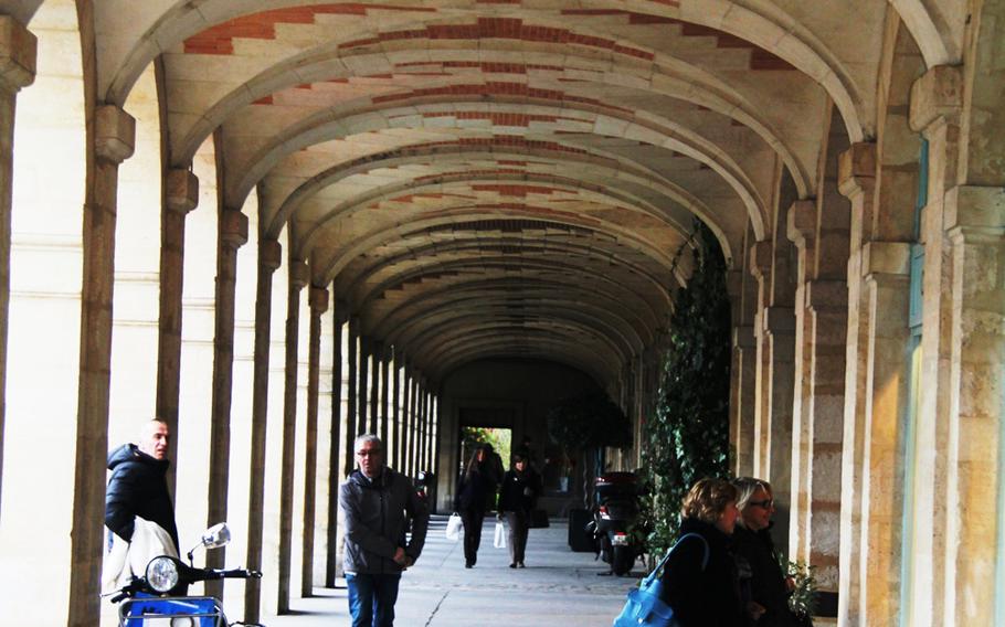 Arcades on the ground floor of the Place des Vosges buildings in the Marais district of Paris.