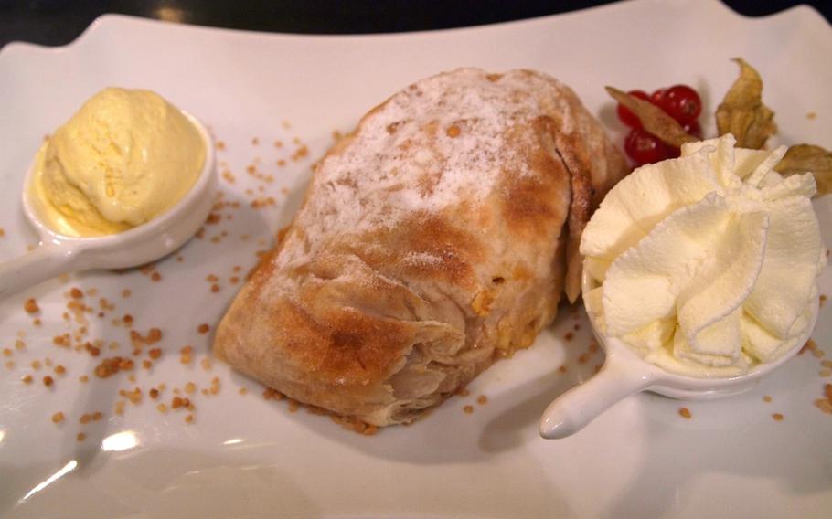 Warm apple strudel served with homemade vanilla ice cream and whipping cream is served throughout the day at the elegant Cafè Maldaner, located in the heart of Wiesbaden, Germany's pedestrian zone.