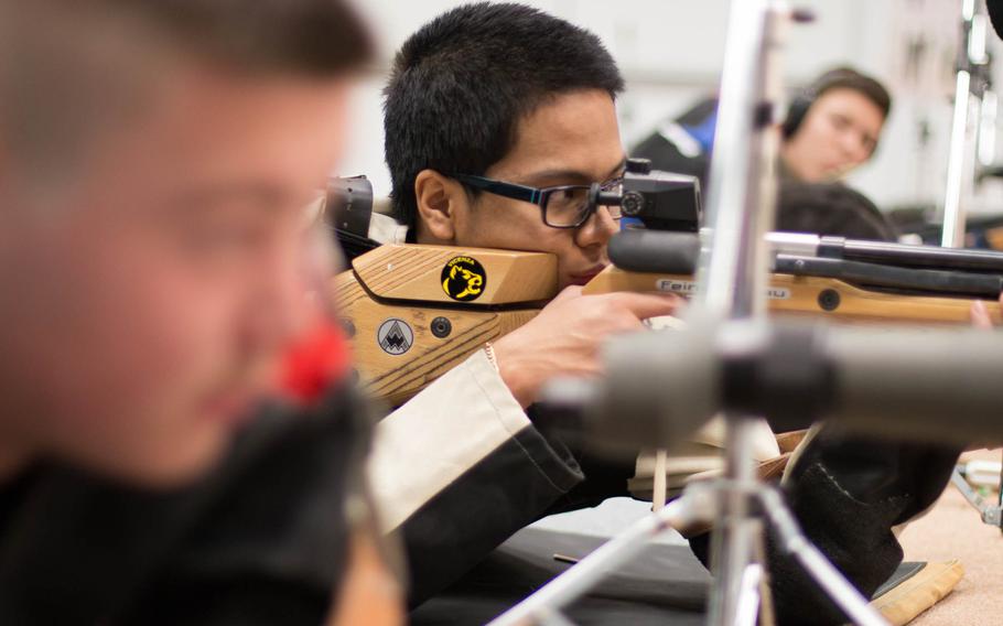 Vicenza's Diego Nacionales ignores all distraction as he takes aim during a rifle match in Vilseck, Germany, Jan 25, 2014. The Vicenza squad traveled to Vilseck but often shoot at their home range and submit scores to compare with those of their opponents in what is known as 'postal' competition.