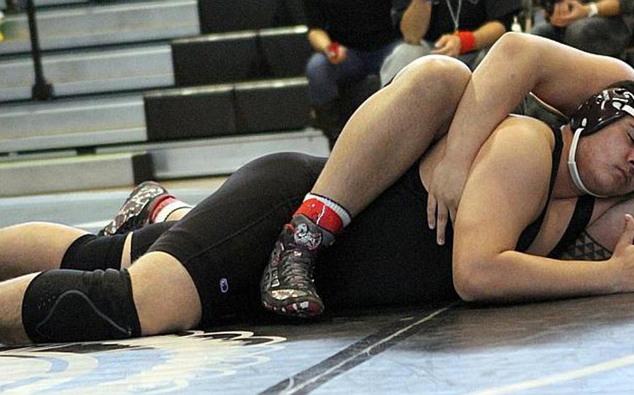 Nile C. Kinnick heavyweight Alaka'i Warford gains the advantage on Zama's Jacob Martin during a DODDS Japan individual freestyle wrestling tournament at Camp Zama, Japan in January. Warford beat Martin for the title.