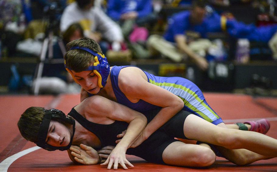 Wiesbaden's Dominic Vatcher, top, defeated Hohenfels' Chase Manhalter to win the 106-pound weight class at the Central Sectional Wrestling Championships at Kaiserslautern, Germany, Saturday, Feb. 8, 2014.