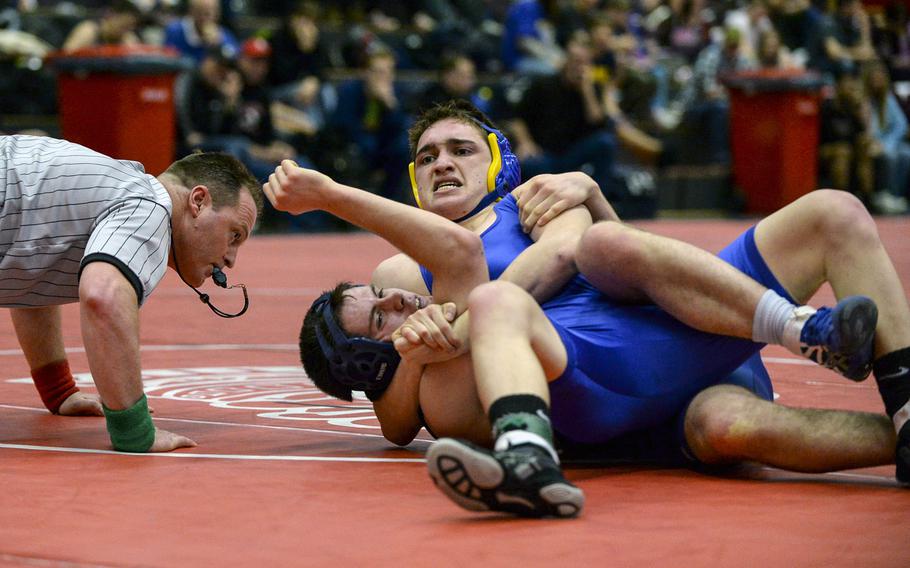 Wiesbaden's Brendan Sturman pins Hohenfels' Jacob Nantz with a head and arm to win the 126 pound weight class at the Central Sectional Wrestling Championships at Kaiserslautern, Germany, Saturday, Feb. 8, 2014.