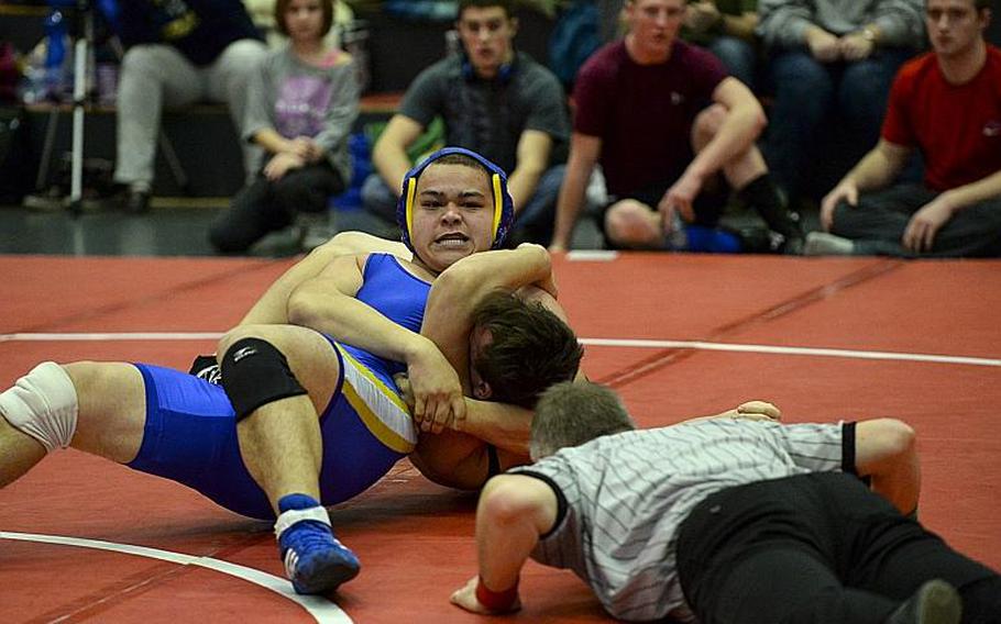 Wiesbaden's Hunter Lunasin pins Baumholder's Nobleman Soule after catching him with a head and arm to win the 220-pound weight class at the Central Sectional Wrestling Championships at Kaiserslautern, Germany, Saturday, Feb. 8, 2014.