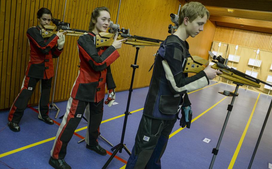 From left to right, Patch's Caelyn Miller, Maggie Ehman and Ben Ferguson prepare to shoot in the bonus round as the top three finishers respectively on the day at the DODDS-Europe championships.