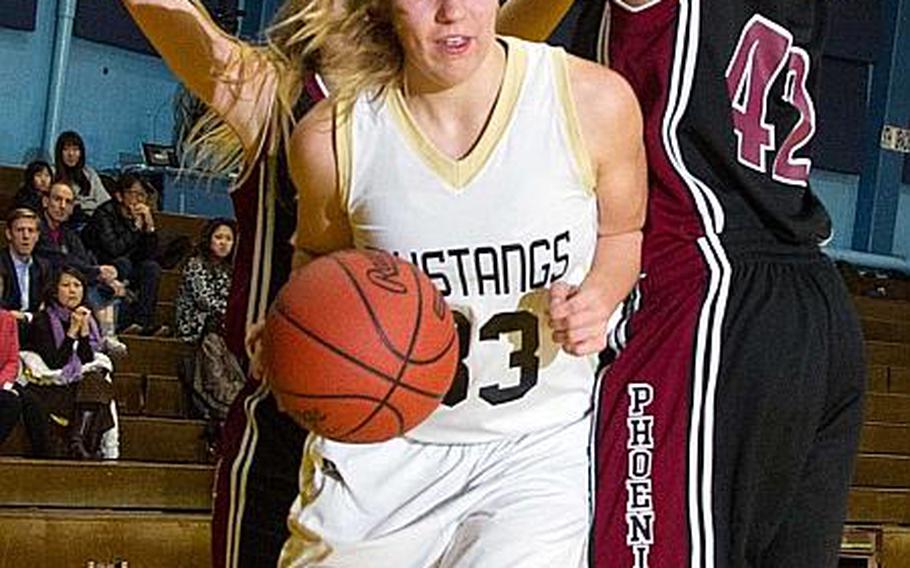 American School In Japan Mustangs junior center Mia Weinland, shown playing in ASIJ's 53-39 win over Seisen International in December, has been named Stars and Stripes Pacific girls high school basketball Athlete of the Year.