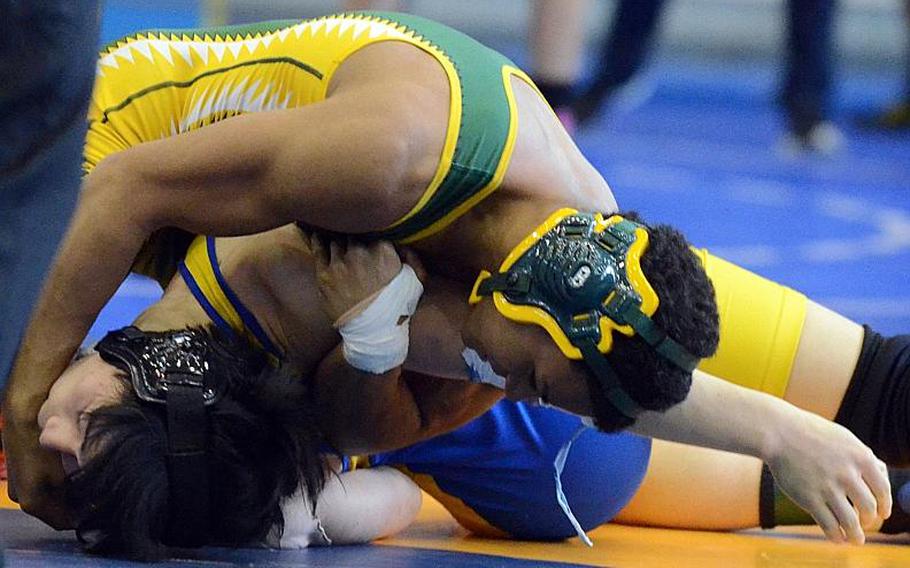 Robert D. Edgren's' Kaleb Atchison, shown winning the Far East High School Wrestling Tournament's 141-pound championship bout over St. Mary's International's Kazuho Kawashima, has been named Stars and Stripes Pacific high school Athlete of the Year.